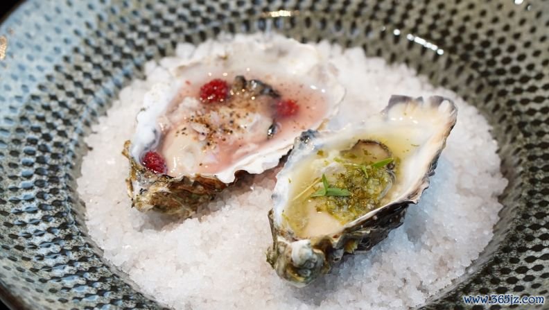 Mr. Jean-Paul, Normandy Oysters: This starter features two oysters -- one hot, one cold. The hot is doused in classic Thai seafood sauce, nahm jim, while the cold oyster is topped with a pickled mulberry sauce.  